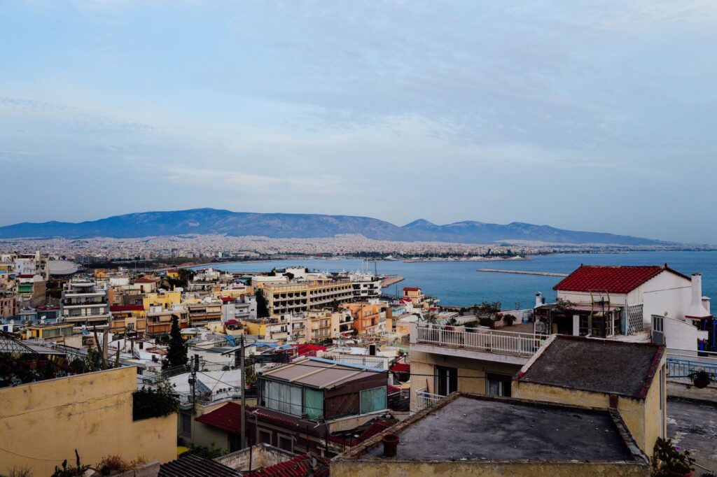 Athens skyline with mountains in the background and the sea