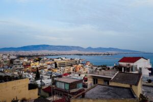 Athens skyline with mountains in the background and the sea
