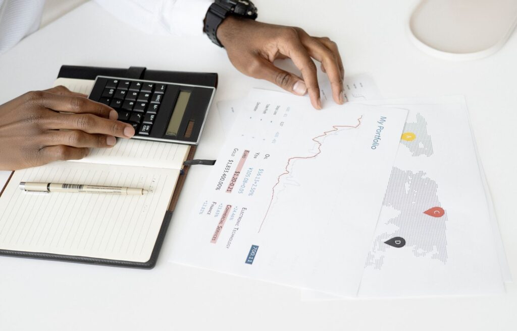 Calculator and financial documents on a desk