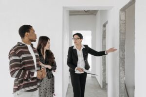 Estate agent showing an apartment to a couple during a viewing