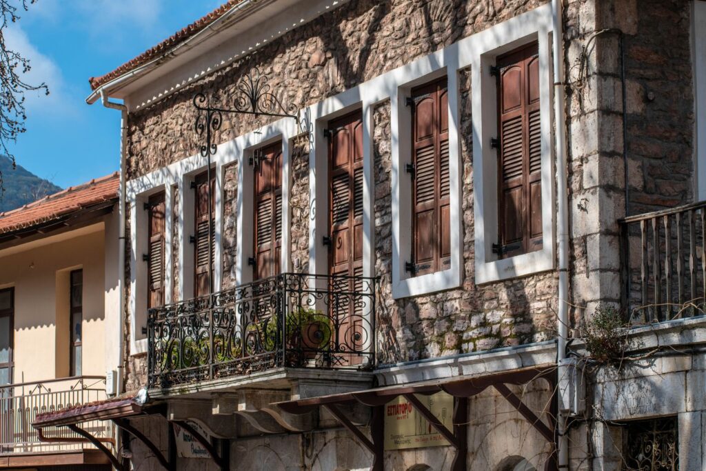 Facade of an old stone house in the village of Andritsaina, Greece
