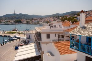Traditional houses rising above the harbour of Skopelos town on a Greek island