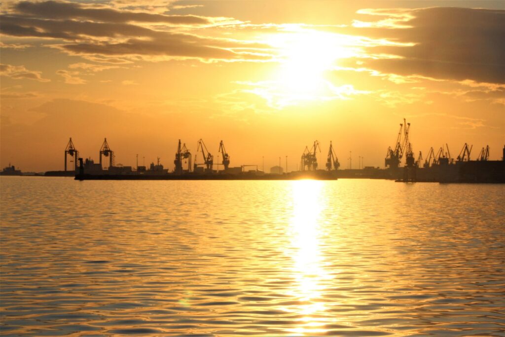 Silhouettes of port cranes and docks at sunset in Thessaloniki harbour